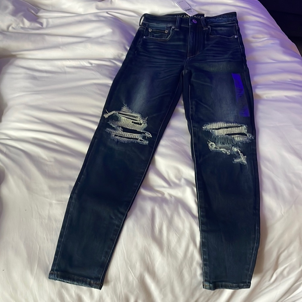 Dark wash, distressed, super stretch hi-rise jegging from American eagle